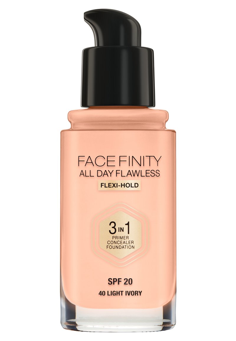 Pumpeflaske med foundation i lys elfenbenfarve, med sort låg og ferskenfarvet base. Indeholder SPF 20 og er mærket som 3-i-1 primer, concealer, foundation.