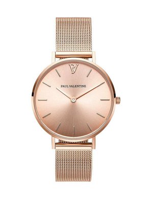 Montre en or rose avec un design minimaliste, dotée d'un cadran rond, d'un bracelet en maille et de repères horaires simples. Logo de la marque positionné à 12 heures.