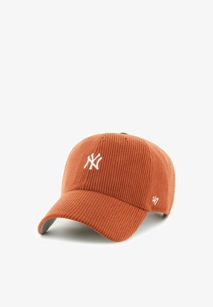 Rust-colored corduroy baseball cap with white New York Yankees logo embroidered on front and '47 brand logo on side.