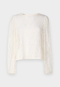 Haut à manches longues en dentelle de couleur blanc cassé, présentant un motif floral, un col rond et une coupe ample avec des poignets élastiqués.