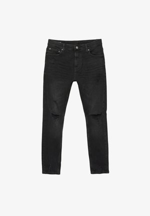 Schwarze Slim-Fit-Jeans mit distressed Löchern an Oberschenkeln und Knien, im Fünf-Taschen-Stil, mit Knopf- und Reißverschluss vorne.