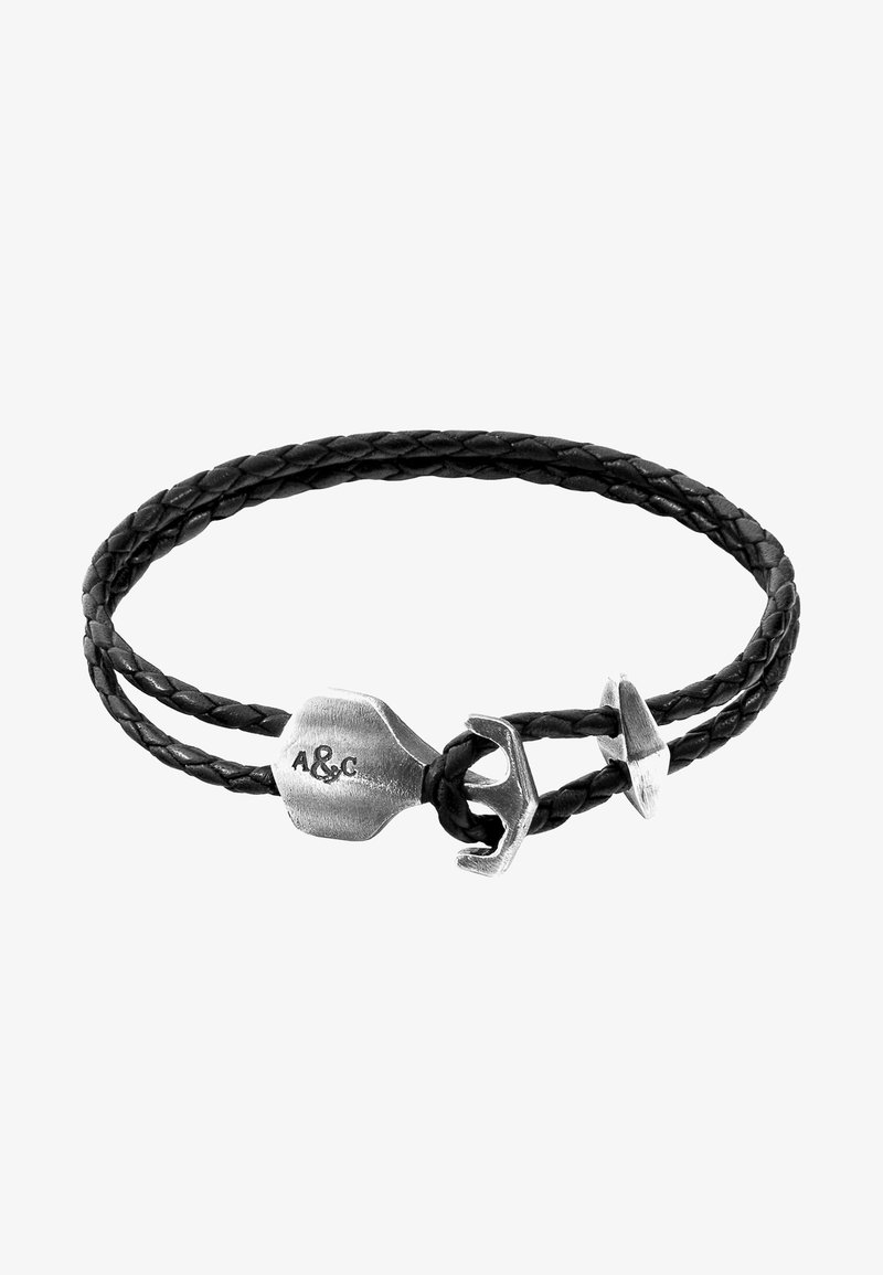 Black braided leather bracelet featuring a silver anchor clasp and a metal tag engraved with "A&C."