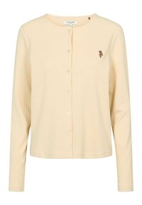 Krémovo sfarbený kardigán s dlhými rukávmi na gombíky, so žebrovanou textúrou a malým vyšívaným logom U.S. Polo Assn. na ľavej strane hrudníka.