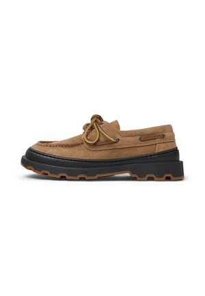 Brown suede boat shoe with black rubber sole, featuring lace detail, stitching accents, and a cushioned footbed. Low profile design.