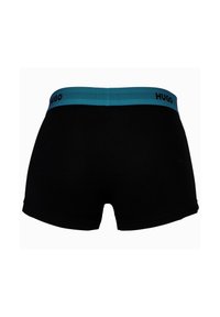 Schwarze Boxershorts für Männer mit einem breiten, türkisfarbenen Bund, der den Markennamen "HUGO" in Schwarz auf der Rückseite zeigt.