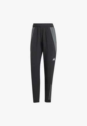 Pantalons de sport noirs avec des accents gris, taille élastique et jambes fuselées. Présente des détails réfléchissants sur les côtés. Fabriqués en matériau léger.