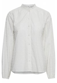 Weiße Baumwollbluse mit rundem, gerüschtem Kragen, Knopfverschluss, langen Ärmeln und strukturiertem Punktmuster im gesamten Stoff.