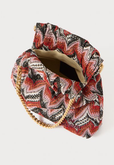 Red and black patterned handbag with a ruched top, gold chain strap, and a textured, woven fabric. Opened view revealing interior.