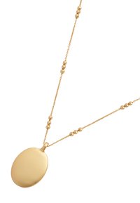 Gold necklace featuring an oval pendant on a delicate chain with spherical accents. Glossy finish, smooth texture, and simple design.