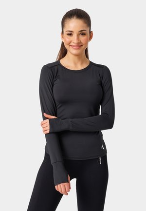 Czarna, długosleeve'owa bluzka sportowa z okrągłym dekoltem, dopasowany krój i otwory na kciuki, zestawiona z czarnymi, teksturowanymi legginsami.