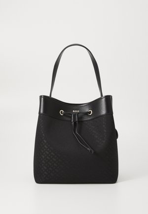 Black tote bag with textured pattern, leather trim, adjustable drawstring closure, and single shoulder strap, branded "BOSS" on front.