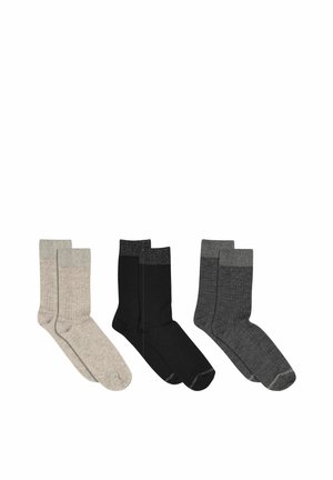 Tre par mellemhøjde sokker i beige, sort og mørkegrå, hver med en ribbet struktur og kontrasterende manchetter.