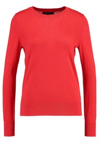 Maglione rosso con maniche lunghe, scollatura rotonda, polsini e orlo a coste. Tessuto liscio e leggero di un colore uniforme, senza fantasie o decorazioni.