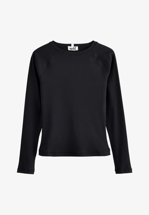 Must pikkade varrukatega pluus soonilise tekstuuriga, ümmarguse kaelusega ja raglaanvarrukatega. Kaela juures silt, millel kiri "self.". Pole nähtavaid kinnitusi.