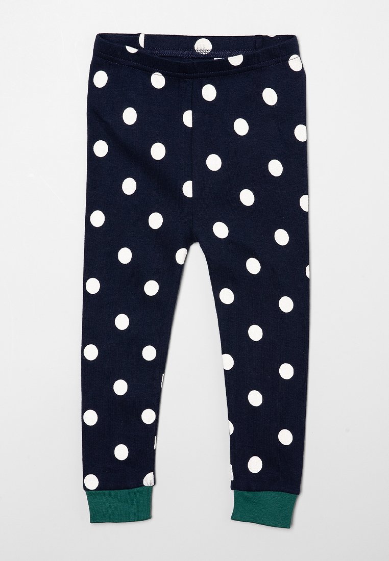 Leggings navy avec de grands pois blancs, dotés d'un revers vert aux chevilles et d'une taille élastique pour un maintien sûr.