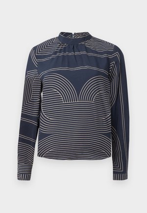 Long-sleeve navy blouse with a high neckline, featuring a geometric cream stripe pattern and subtle pleating along the front.