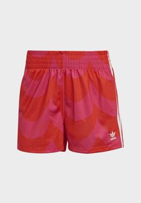 Red and pink patterned shorts with a scalloped design, elastic waistband, and side white stripes; made from lightweight fabric.