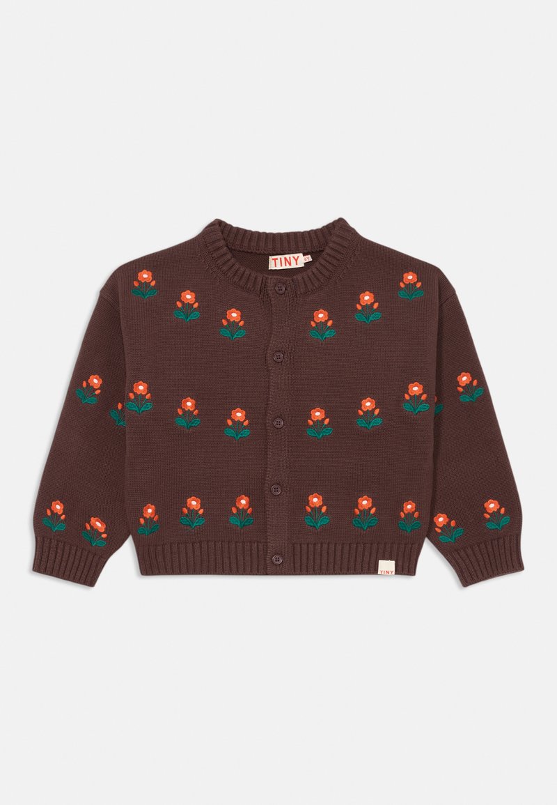 Brūns adīts džemperis ar oranžām ziedu izšuvumiem un zaļām lapām, priekšējām pogām un ribotiem piedurknēm. Uz birkas rakstīts "TINY."