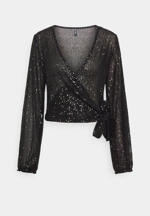 Blouse noire à manches longues avec tissu rayé transparent et sequins dispersés, dotée d'un lien latéral à la taille.