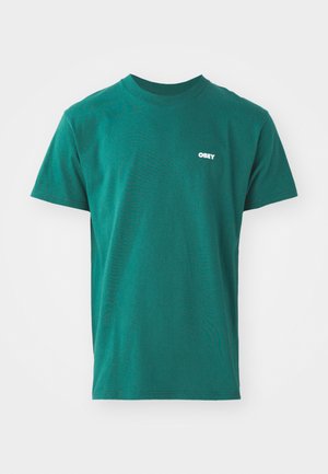 Green short-sleeve t-shirt made of cotton, featuring a crew neck and small white "OBEY" logo on the left chest. Smooth texture, classic fit.