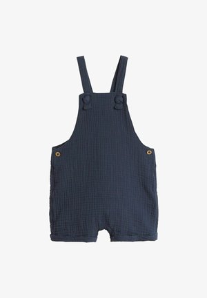 Laivasilakkia siniset puuvillamusliini haalarit, joissa on säädettävät hihnat, sivutaskut ja puunapit. Rakenteellinen, kevyt ja lyhytlahkeinen muotoilu.