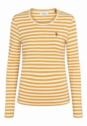 Kollane ja valge triibuline pika varrukaga särk, millel on ribakonstruktsioon ja ümmargune kaelus. Rinnaosa on kaunistatud väikese broderi logoga.