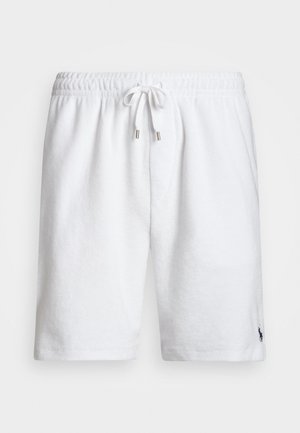 White cotton shorts with textured fabric, elastic waistband, drawstring with silver tips, and a small navy logo on the lower right leg.