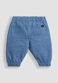Pantaloni jogger in cotone blu morbido con vita elastica, polsini elasticizzati e due tasche posteriori. Presenta un piccolo logo "Jojo".