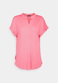 Rosa Kurzarmoberteil mit V-Ausschnitt, das einen lockeren Schnitt und strukturierten Stoff bietet. Seitenschlitze sorgen für zusätzliche Bewegungsfreiheit.