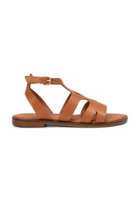 Brown leather sandals with multiple wide straps, open toe, and a side buckle closure; flat sole with subtle wood grain accents.