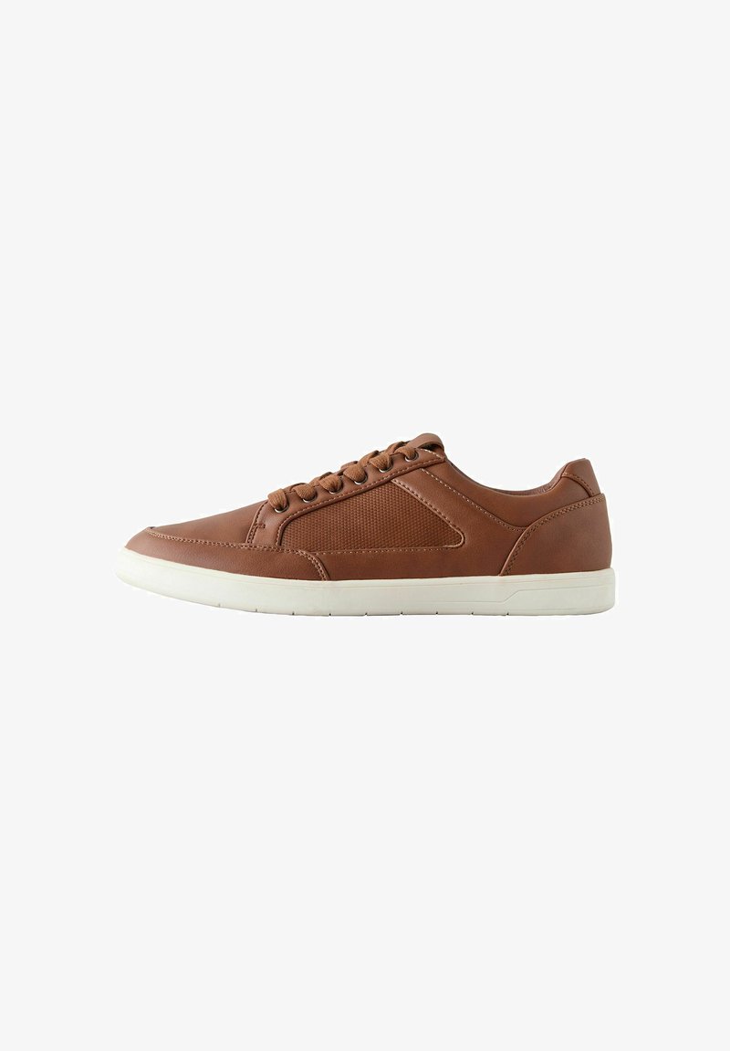 Brown leather sneakers with textured side panels, round toe, and white rubber soles. Features brown lace-up closure and minimalistic design.