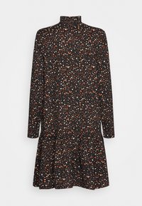 Musta mekko pitkillä hihoilla ja korkealla kauluksella, jossa on oranssia, valkoista ja ruskeaa läiskikästä kuviota sekä levenevä helma.