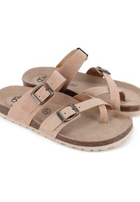 Sandalias de ante beige con hebillas ajustables, plantilla acolchada y suela de goma texturizada. Las correas presentan un diseño minimalista.