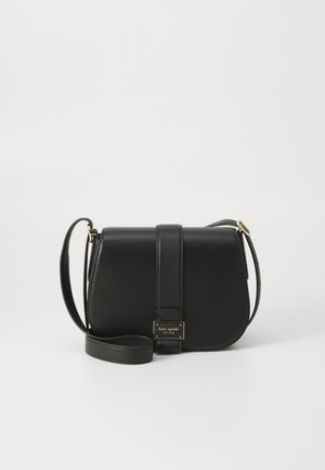 Black leather crossbody bag featuring a structured design, flat flap closure, and a gold hardware logo plaque. Adjustable strap included.