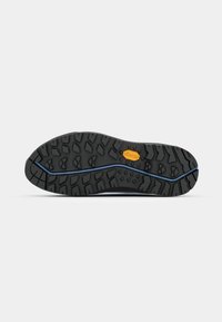 Black rubber shoe sole with deep treads, a blue accent line, and Vibram logo in orange. Textured surface for grip and durability.