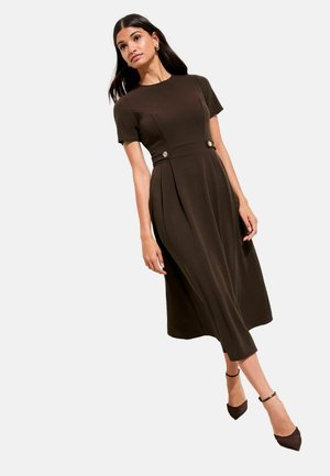 Brown, short-sleeved dress with a fitted bodice and pleated skirt, featuring decorative gold buttons at the waist. Classic design.