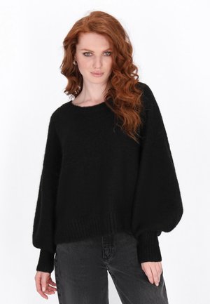 Pulover negru din tricot, cu croi lejer, mâneci largi și manșete cu nervuri. Fabricat dintr-un material moale, având un guler rotund și detalii texturate.