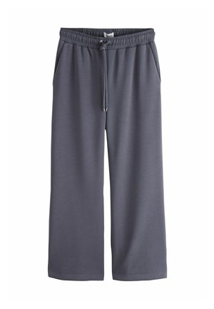 Pantalon large gris foncé avec taille élastique et cordon ajustable, avec poches latérales.