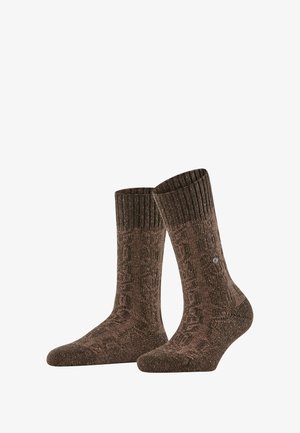 Chaussettes marron à motifs avec un bord côtelé. Fabriquées en matériau texturé, mettant en avant un design subtil et un petit logo sur le côté.