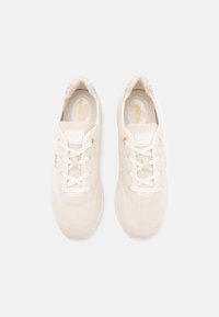 White athletic sneakers with mesh fabric, lace-up closure, gold-accented eyelets, and cushioned insoles. Minimalist design.