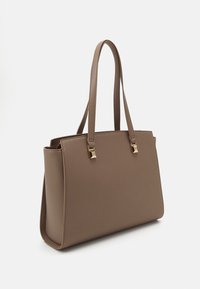Brown synthetic tote bag with flat sides, two long handles, and gold square hardware accents. Smooth texture and structured design.