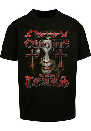 Maglietta nera con stampa grafica di un volto con capelli lunghi, con dettagli rossi e il testo "Ozzy Osbourne No More Tears" in carattere grassetto.
