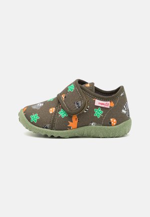 Children's shoe made of brown fabric, featuring colorful animal and plant patterns. Velcro strap, rounded toe, and green rubber sole.