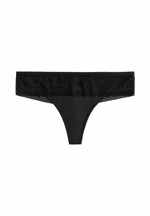 String noir comportant une taille en dentelle avec des motifs floraux et des détails transparents, conçu en tissu lisse pour un confort optimal.