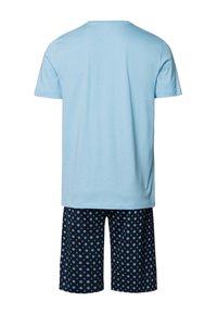 Light blue cotton T-shirt with short sleeves, paired with navy shorts featuring a geometric pattern in light blue and white.