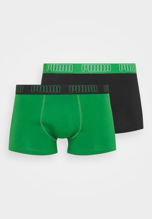 Boxershorts aus lebhaftem grünen und schwarzen Baumwollmaterial, mit breiten elastischen Bändern, die das kontrastierende "PUMA"-Logo tragen. Glatte Textur und enganliegendes Design.