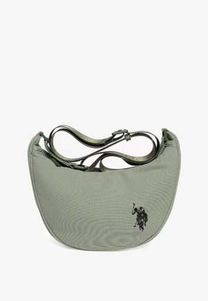 Zielona torebka na ramię z zakrzywionym kształtem, z ozdobnym czarnym haftem, regulowanymi paskami i teksturowaną powierzchnią.