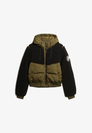 Cropped jacket featuring an olive green quilted body and black fleece sleeves, with a drawstring hood and logo patch on the left sleeve.