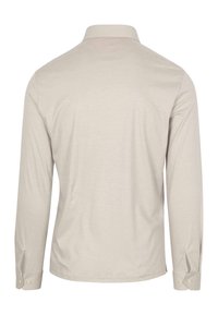 Lange mouwen shirt in lichtbeige stof, met een kraag en knoopmanchetten. Gladde textuur met een subtiel, schoon ontwerp.