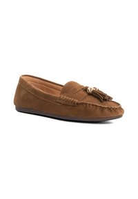 Brown suede loafers with a flat sole, featuring decorative tassels and stitching details on the upper for added texture and design.
